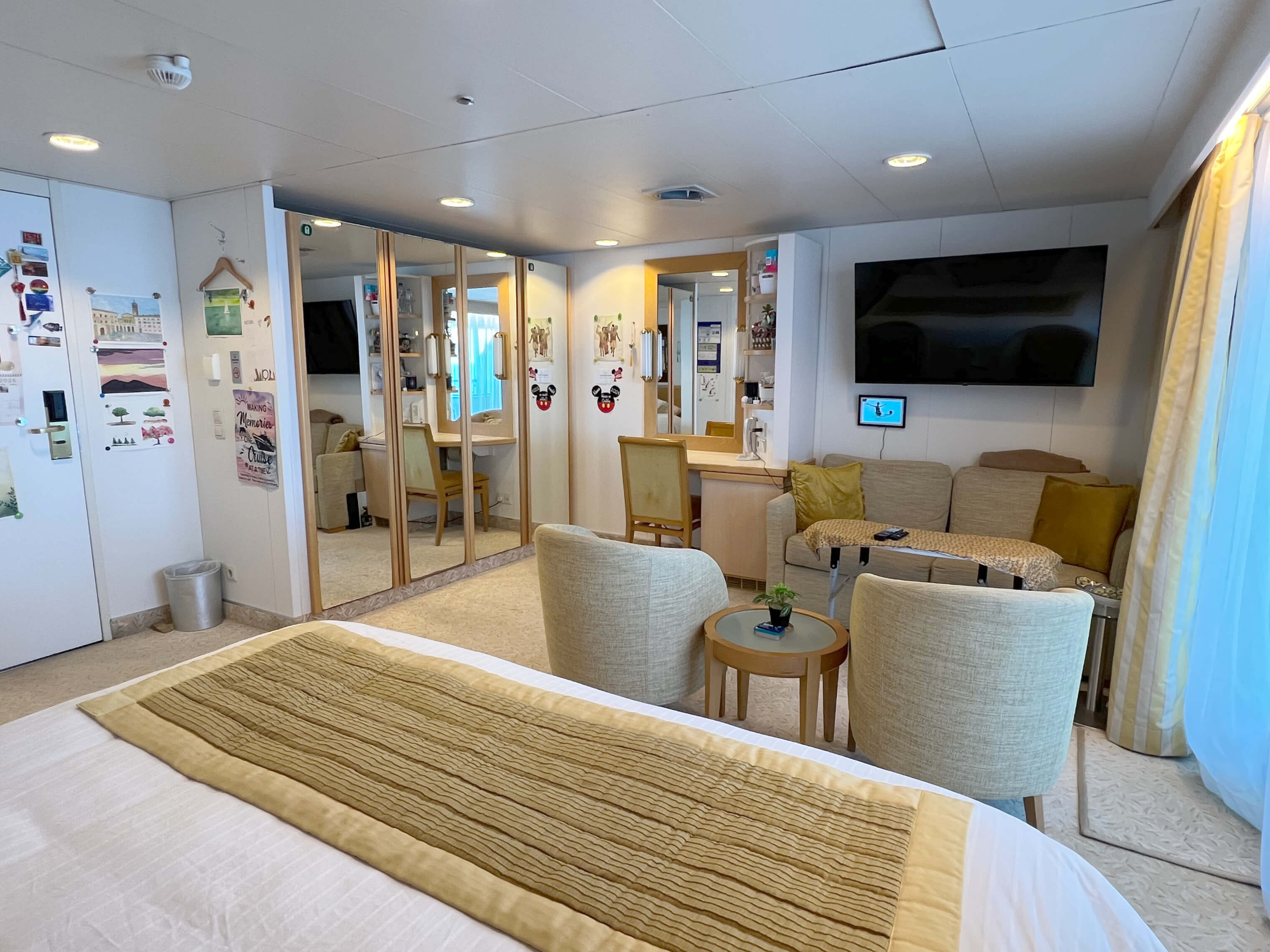 View of the cabin from the window towards the cabin door, showing sitting area.